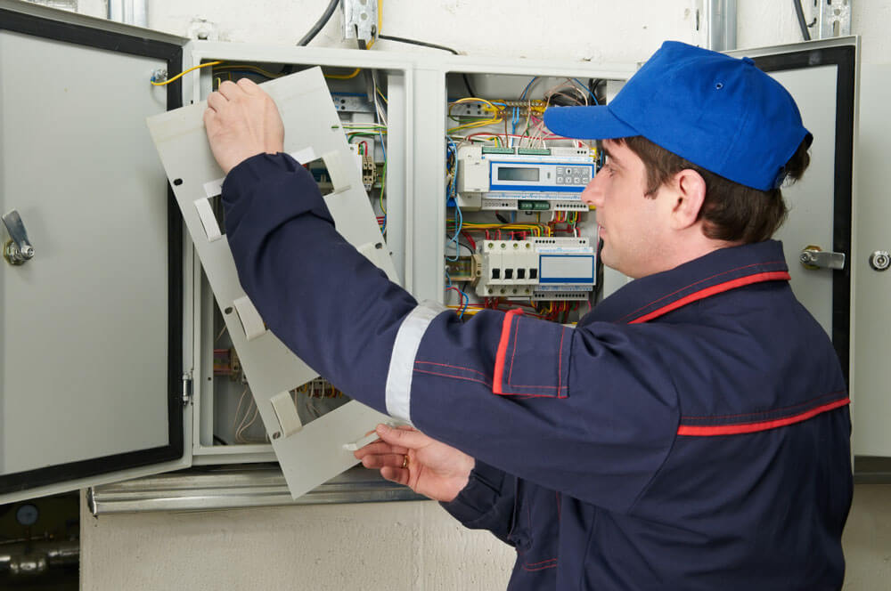 Man Fixing Electricals Man Fixing Electricals